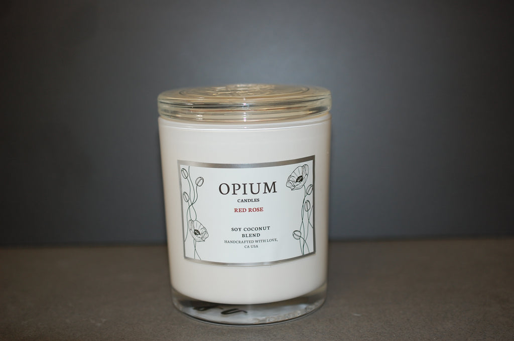 Candle with 'Opium' label on a gray background
